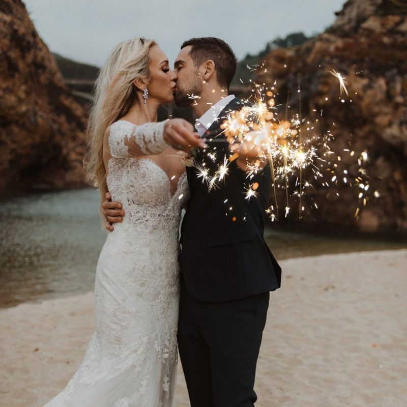 Sparkler moment on the beach at California elopement