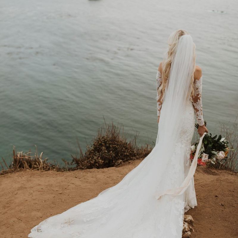 Bride in lace Pronovias wedding dress and wedding veil