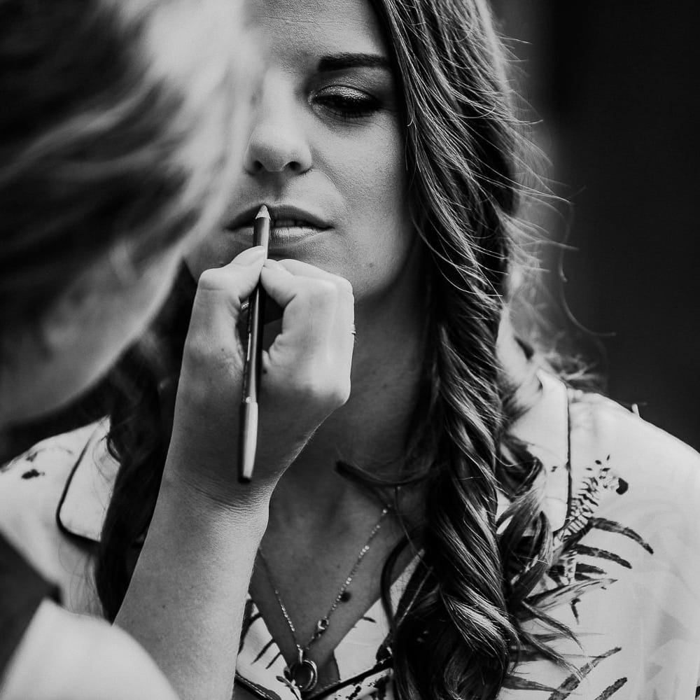 Beautiful Bride Having Her Hair and Makeup Done on The Morning of The Wedding