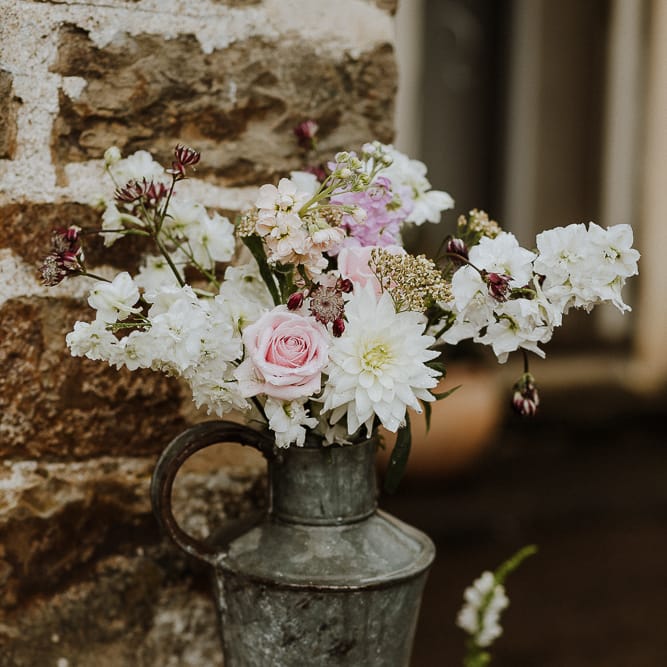 Metal Jug Filled with Wild Wedding Flowers