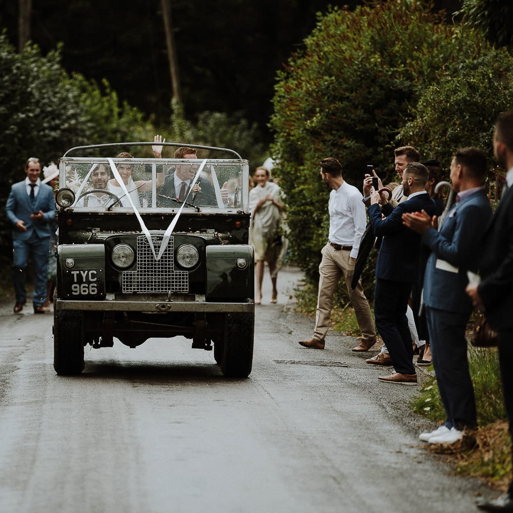 Bride and Groom in Land Rover Wedding Car