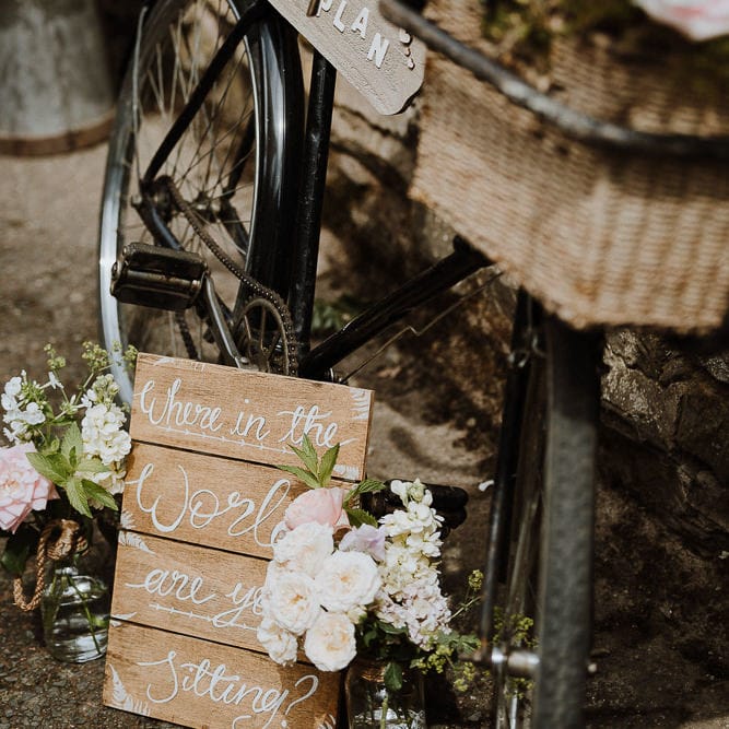 Wooden Table Plan Sign Tied to Vintage Bicycle
