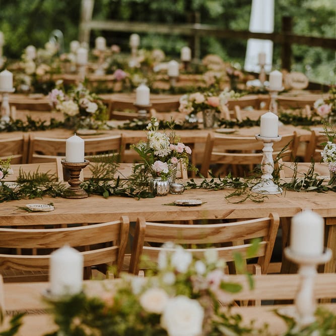 Wooden Tables with Candles and Flower Decor