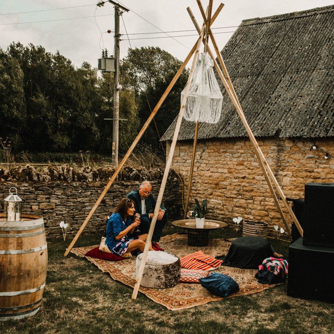 Boho Seating Area For Wedding // Bride In The Row For Bohemian Wedding In The Cotswolds With PapaKata Tipi And Ceremony At Merriscourt With Images From Carla Blain Photography