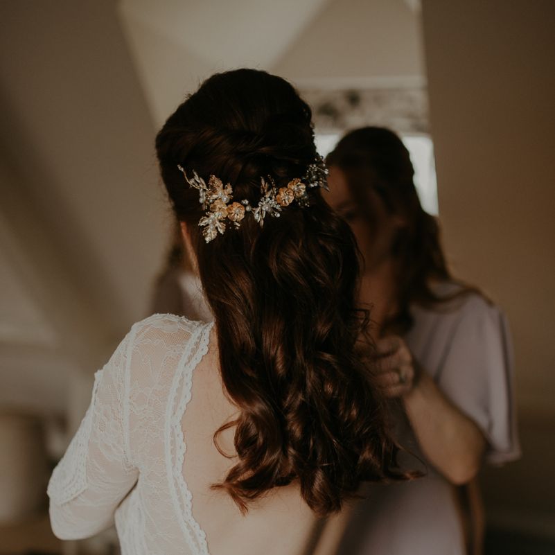 Half up half down wedding hair with floral headdress