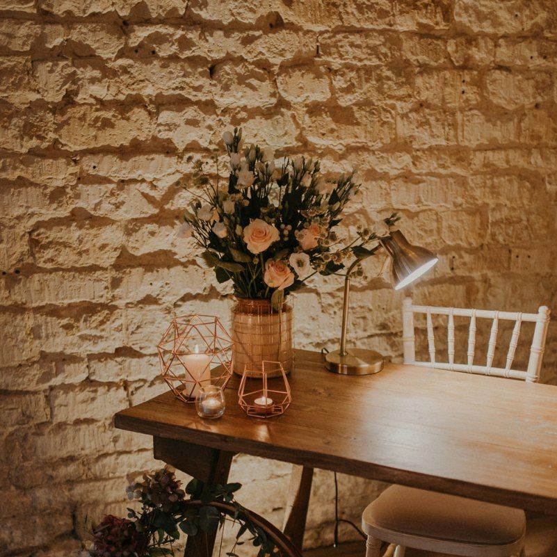 Register table with rustic wedding decor and candles at Lapstone Barn