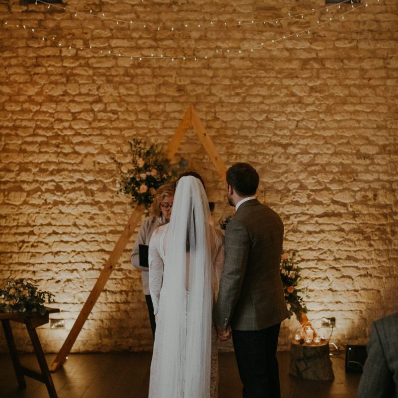 Bride and groom standing at the altar at Lapstone Barn
