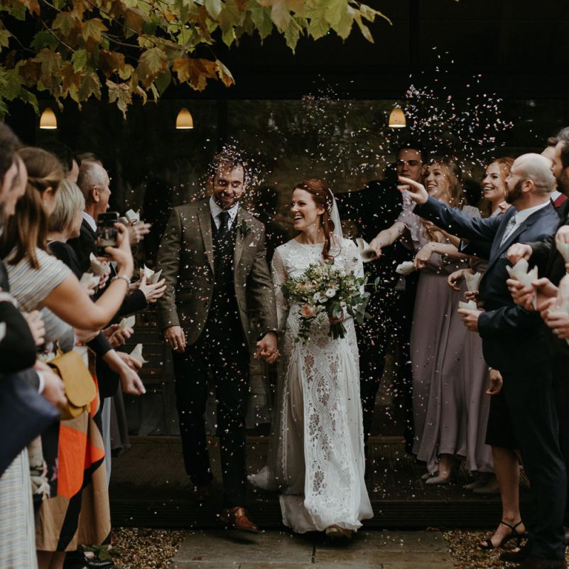 Confetti moment at Lapstone Barn with bride in Inca Grace Loves Lace dress