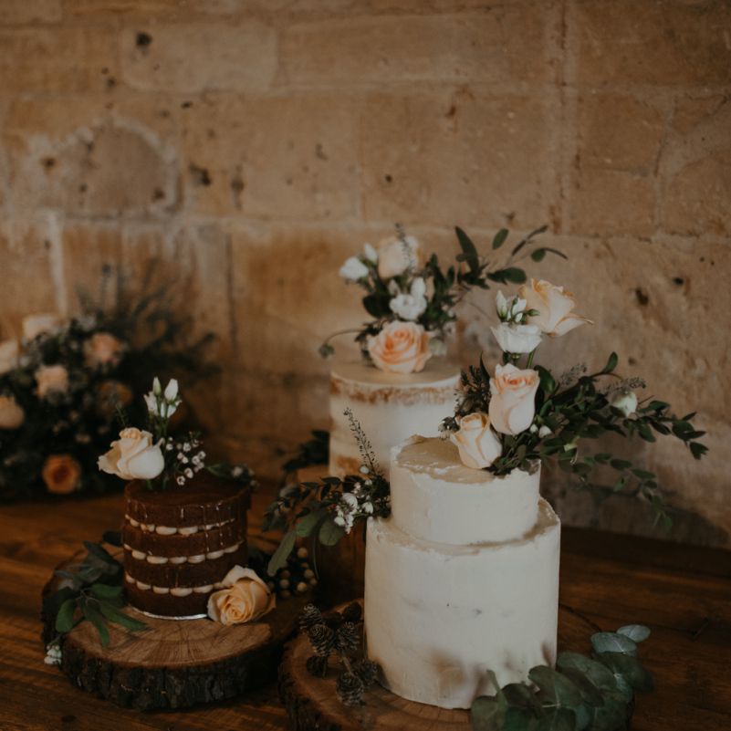 Dessert table with individual cakes on tree slices
