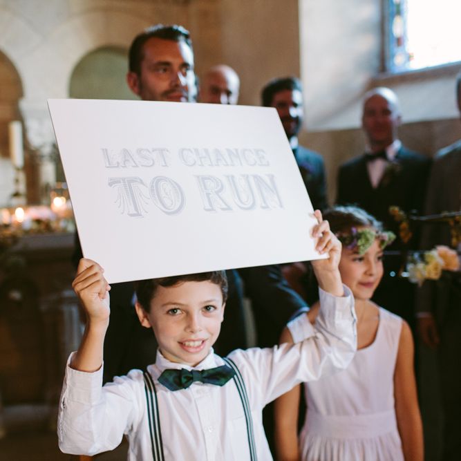 Page Boy with Last Chance to Run Wedding Sign | Stylish Two Day Wedding at Château de Varennes, Burgundy, France with I Do BBQ After Party Planned by Bulle &amp; Tulle | Troistudios Photography | Studio80  Film