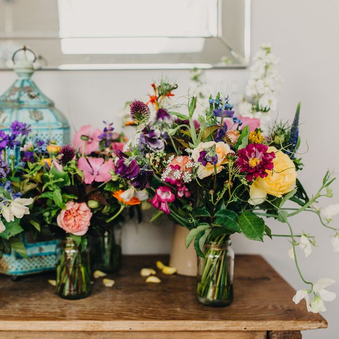 Bouquets of Bright Wild Flowers | Colourful Bunting Wedding Decor for a Festival Themed Marquee Wedding | Peppermint Love Photography