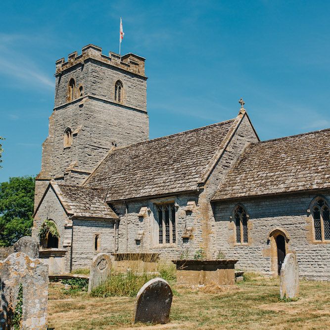 The Church of the Holy Cross, Babcary, Somerset | Colourful Bunting Wedding Decor for a Festival Themed Marquee Wedding | Peppermint Love Photography