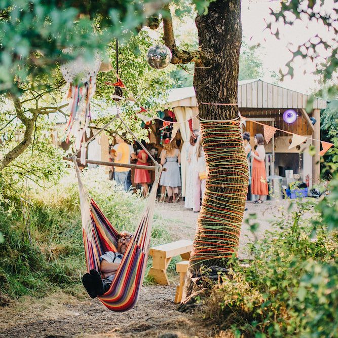 Hammock | Dreamcatchers | Glitter Ball | Colourful Bunting Wedding Decor for a Festival Themed Marquee Wedding | Peppermint Love Photography