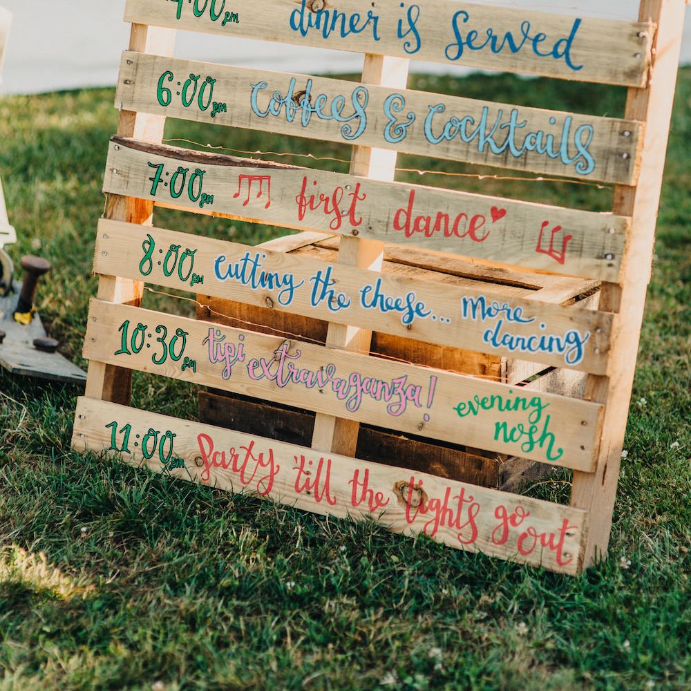Order of the Day Pallet | Colourful Bunting Wedding Decor for a Festival Themed Marquee Wedding | Peppermint Love Photography