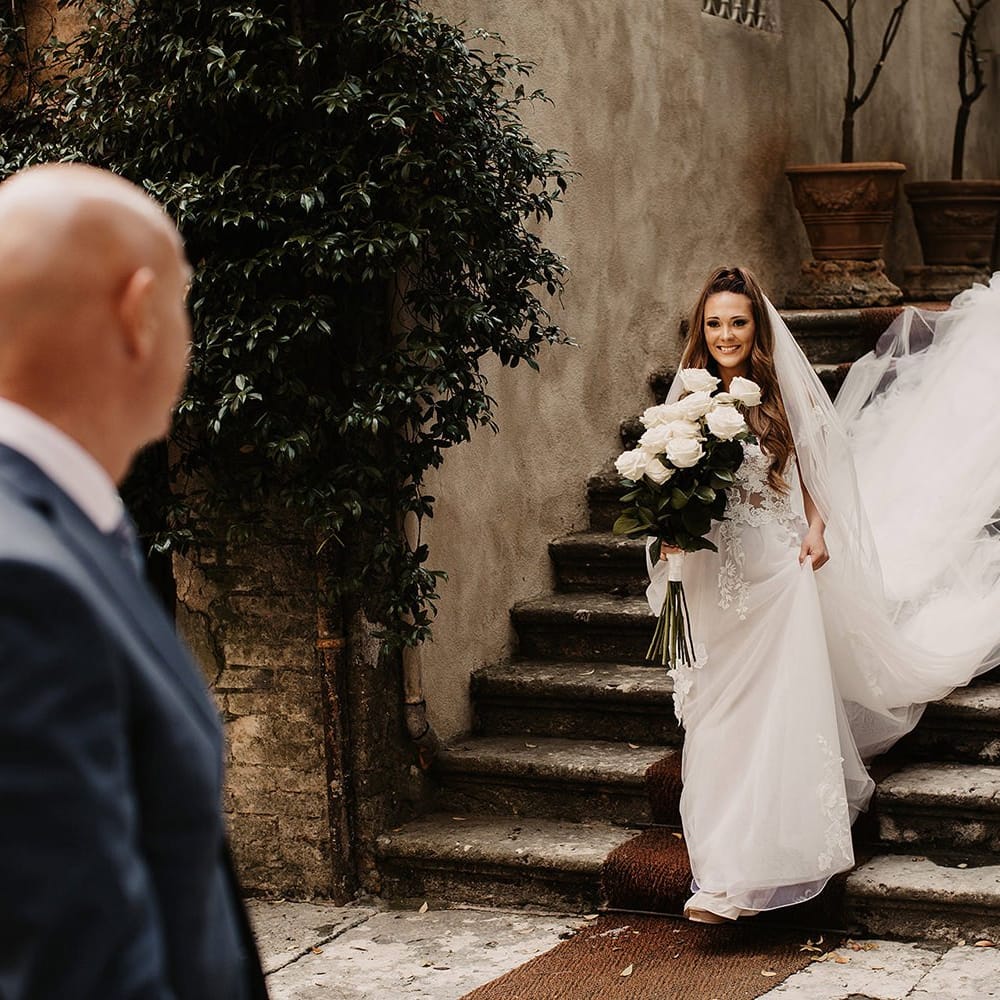Bride in Galia Lahav wedding dress with long veil
