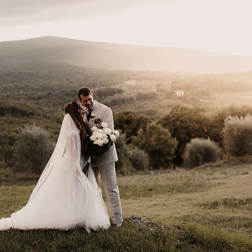 Bride in Galia Lahav wedding dress with long veil