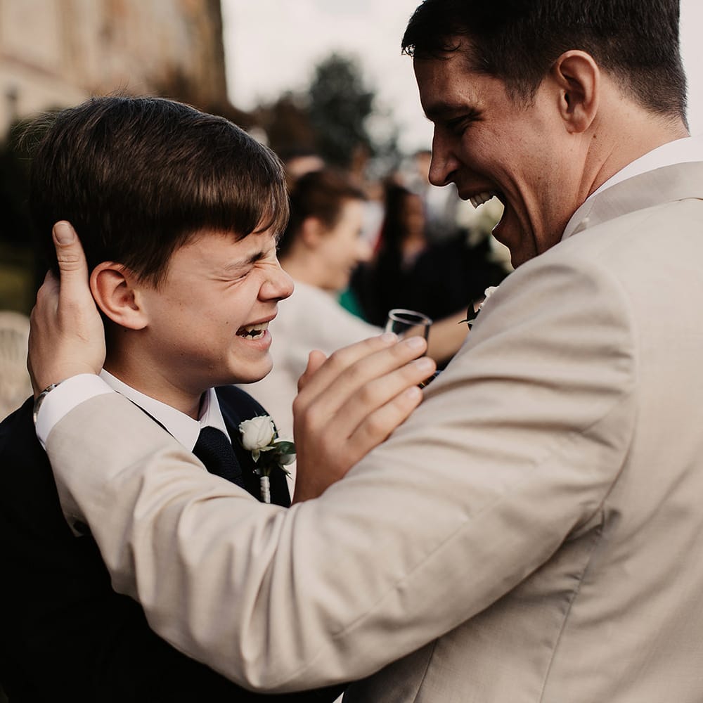 Groom greets wedding guests