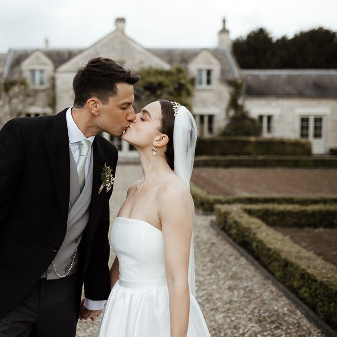 Bride In Strapless Wedding Dress With Bouquet And Veil