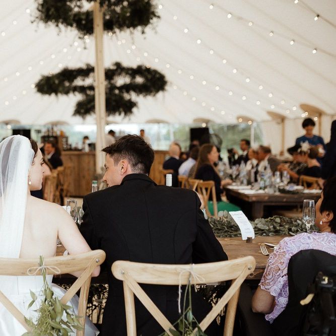 Bride In Strapless Wedding Dress During Reception With New Husband