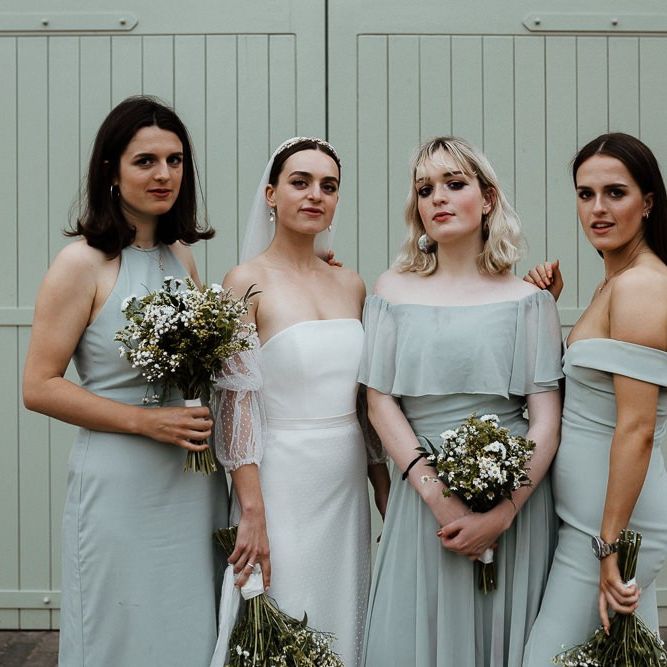 Bride In Strapless Wedding Dress With Blue Bridesmaid Dresses
