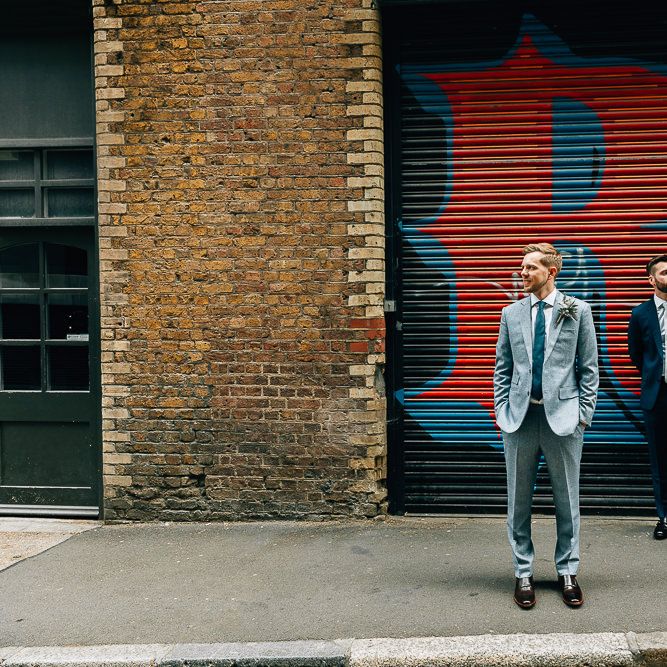 Pre Ceremony Photos in Shoreditch | Groom in Dark Petrol Blue Suit by Paul Smith | Groom in Light Blue Made To Measure Suit by Beggars Run | Dark Brown Russell &amp; Bromley Shoes | Brown Aldo Shoes | Same Sex Wedding with Industrial Styling at Wimborne House | Marmelo Photography