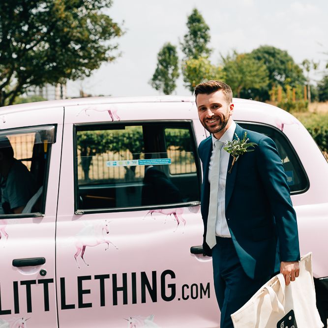 Arrival of the Grooms | Pink London Taxi | Groom in Dark Petrol Blue Suit by Paul Smith | Same Sex Wedding with Industrial Styling at Wimborne House | Marmelo Photography