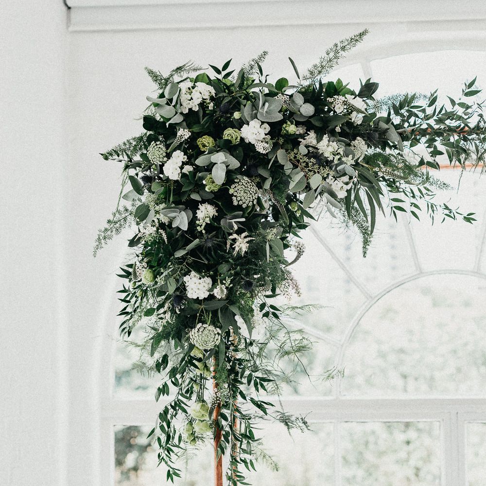 Wedding Ceremony Decor | Copper Arch with White Flowers and Foliage | Whitewashed Walls | Same Sex Wedding with Industrial Styling at Wimborne House | Marmelo Photography