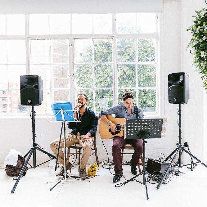 Wedding Ceremony | Acoustic Duo | Copper Arch with White Flowers and Foliage | Whitewashed Walls | Same Sex Wedding with Industrial Styling at Wimborne House | Marmelo Photography
