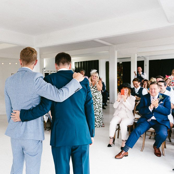 Wedding Ceremony | Just Married | Festoon Lights | Groom in Dark Petrol Blue Suit by Paul Smith | Groom in Light Blue Made To Measure Suit by Beggars Run | Same Sex Wedding with Industrial Styling at Wimborne House | Marmelo Photography