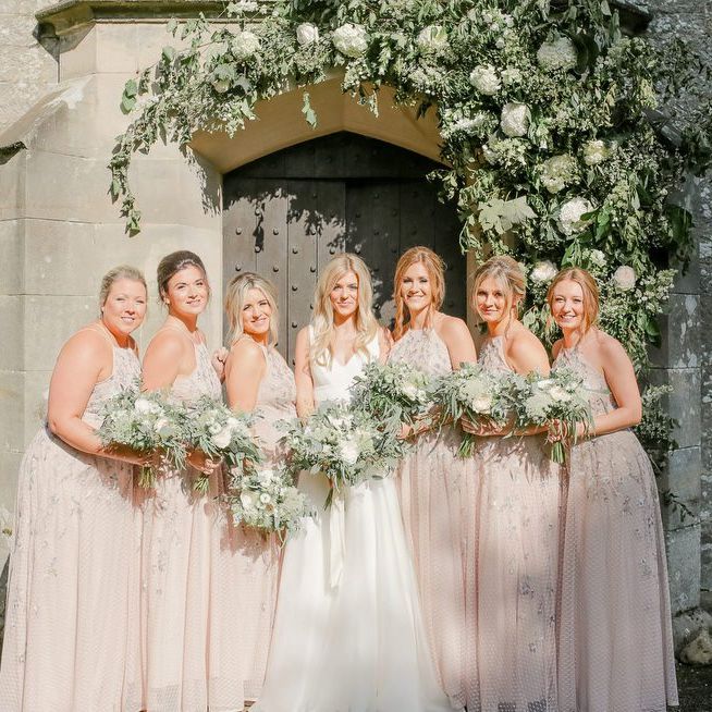 bridal party portrait with bridesmaids in pink dresses