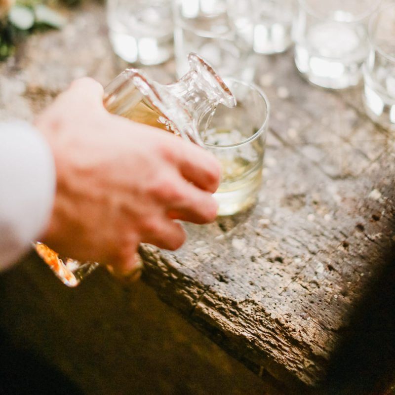 Groomsmen drinking whiskey on wedding morning