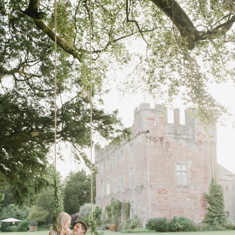 Bride and groom portrait on the swing at Askham Hall wedding venue