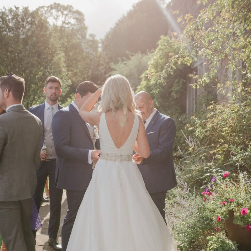 Bride in Sassi Holford wedding dress and belt