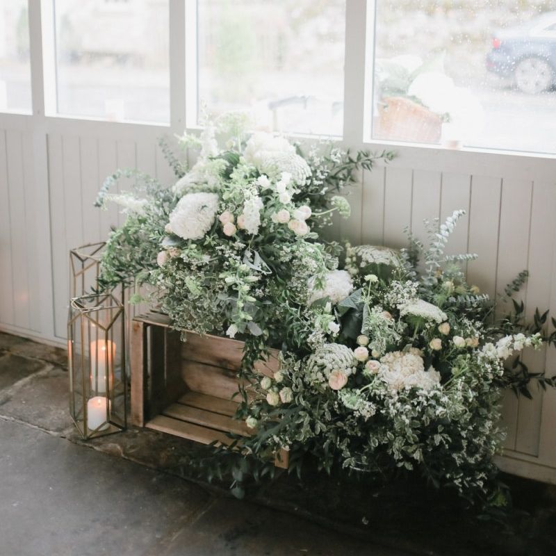 Rustic crate, lantern and flower wedding decor at Askham Hall