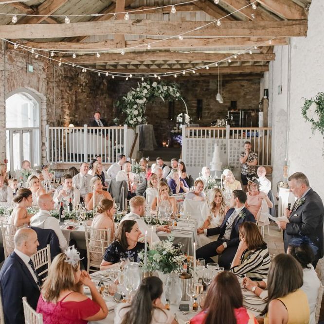 Wedding guests enjoying the wedding breakfast at Askham Hall