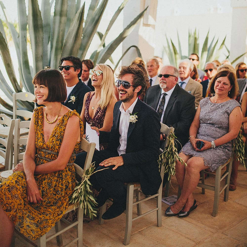 Outdoor Wedding Ceremony | Wedding Guests | Brightly Coloured Destination Wedding at Masseria Potenti Wedding Venue, Puglia, South Italy | Petar Jurica Photography | Marco Odorino Film