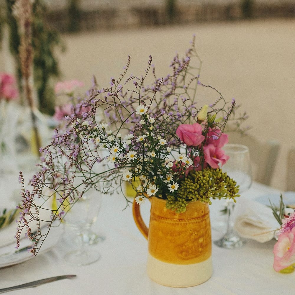 Wild Flowers in Pitcher Jug | Wedding Decor | Brightly Coloured Destination Wedding at Masseria Potenti Wedding Venue, Puglia, South Italy | Petar Jurica Photography | Marco Odorino Film