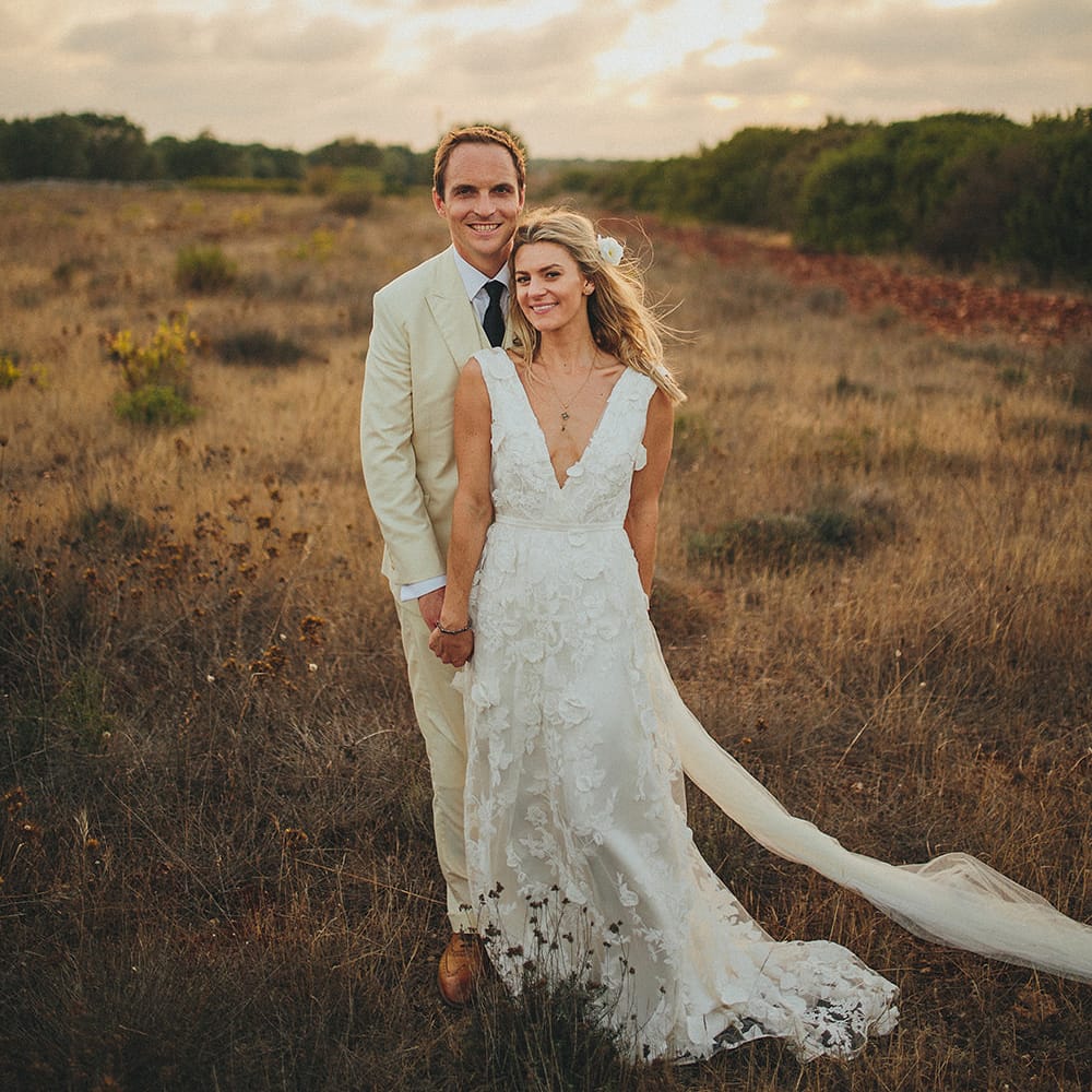 Bride in Custom Clemence Halfpenny London Bridal Gown | Groom in Cream Three Piece Suit | Brightly Coloured Destination Wedding at Masseria Potenti Wedding Venue, Puglia, South Italy | Petar Jurica Photography | Marco Odorino Film