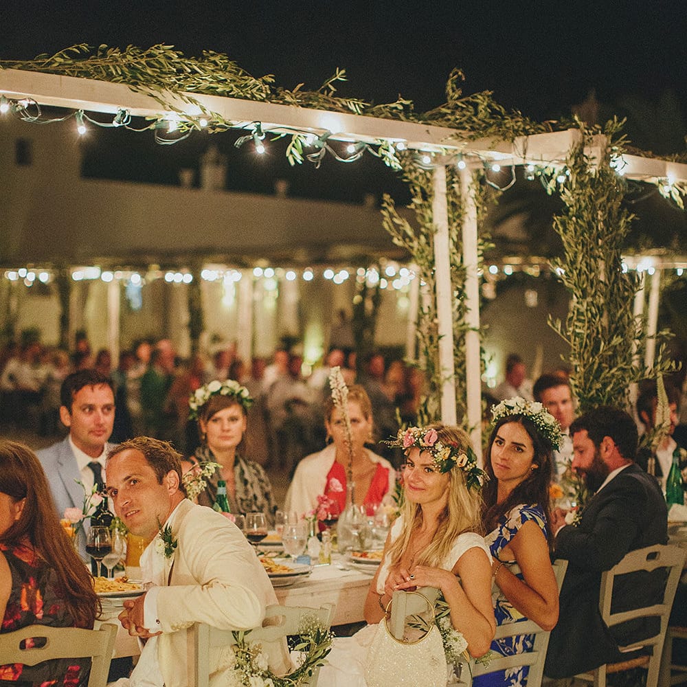 Outdoor Wedding Reception with Fairy Lights | Brightly Coloured Destination Wedding at Masseria Potenti Wedding Venue, Puglia, South Italy | Petar Jurica Photography | Marco Odorino Film