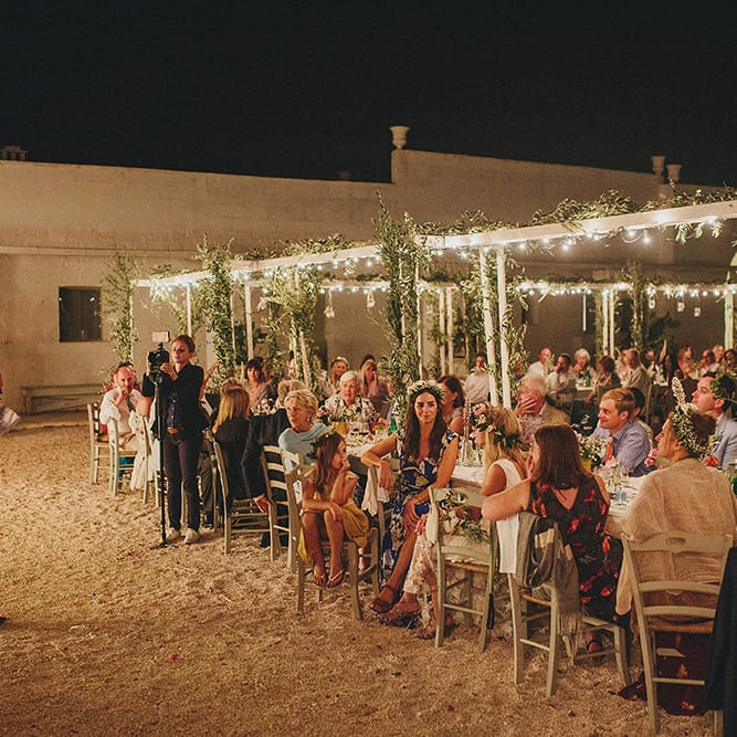 Outdoor Wedding Reception with Fairy Lights | Brightly Coloured Destination Wedding at Masseria Potenti Wedding Venue, Puglia, South Italy | Petar Jurica Photography | Marco Odorino Film
