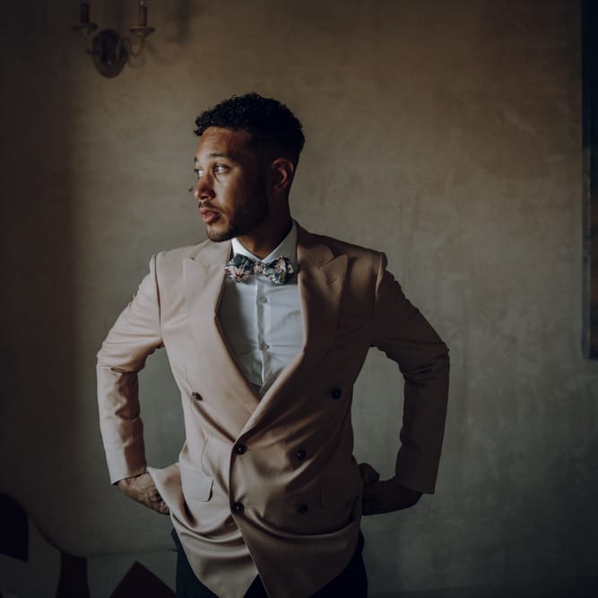 Groom in double breasted pale pink blazer