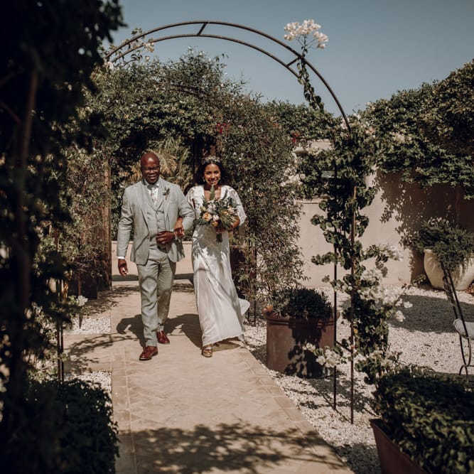 Outdoor wedding ceremony bridal entrance in Grace Loves Lace wedding dress