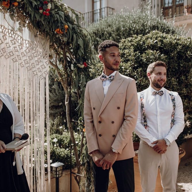 Groom standing at the altar in double breasted blazer