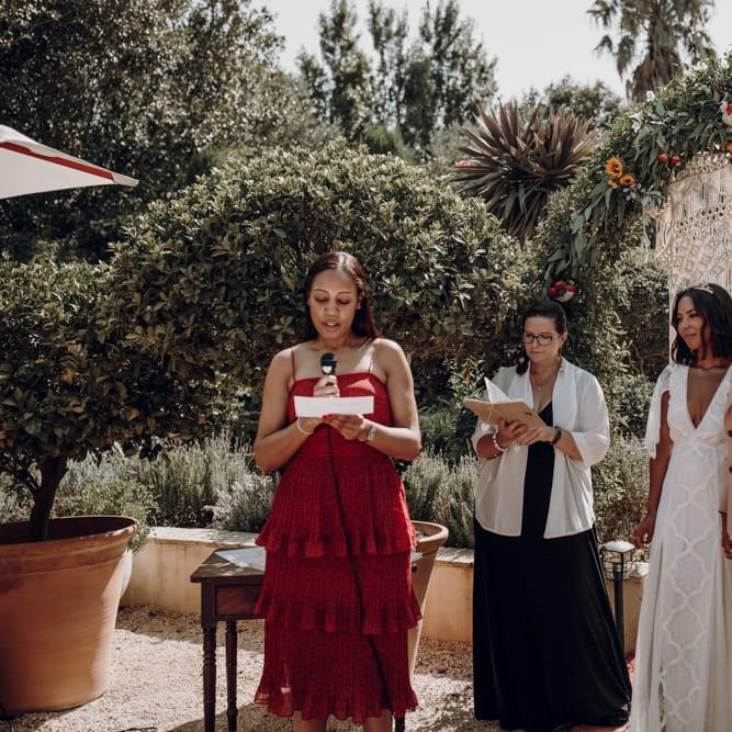Bridesmaid in bronze dress performing a reading