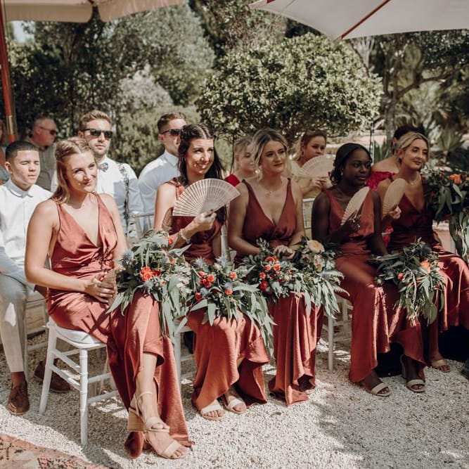 Bridesmaids in bronze satin dresses