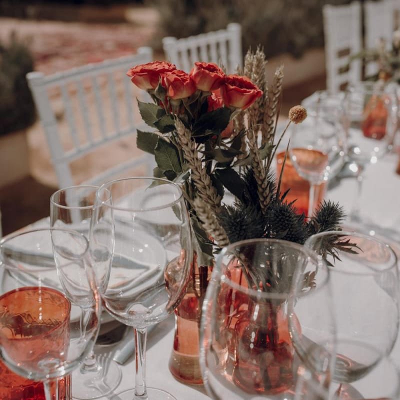 Orange goblets and flower table decor