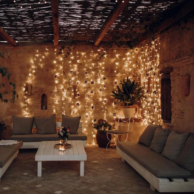 Chill out area with string lights and polaroid pictures