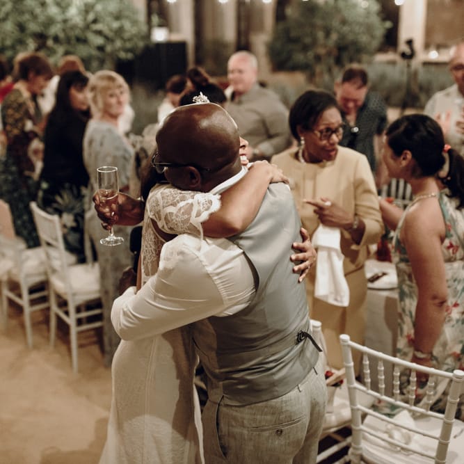 Bride embracing her father at the wedding reception