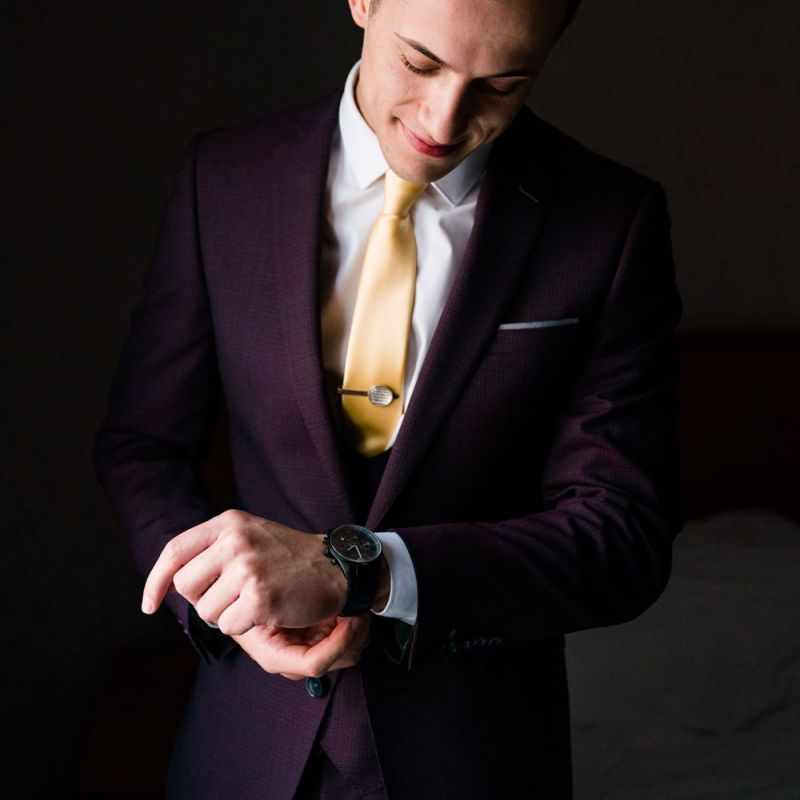 Groom in Burgundy Remus Uomo Suit