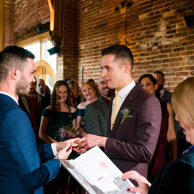 Two Grooms in Burgundy and Navy Remus Uomo Suits